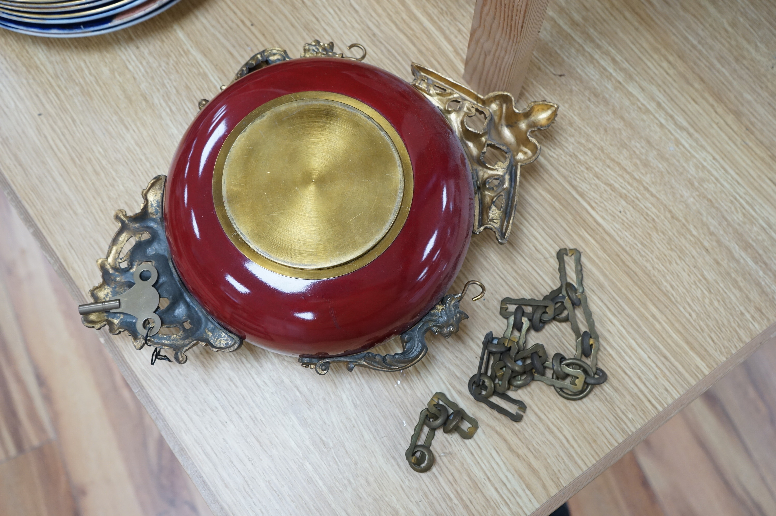 A late 19th century French hanging enamel and gilt metal wall clock. 38cm high without chain. Condition - fair to good